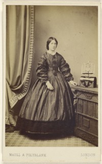 woman wearing a long dress, standing; Maull & Polyblank, British, active 1850s - 1860s, 1862 - 1865; Albumen silver print