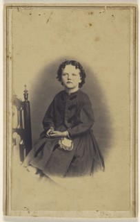 little girl kneeling in a chair, printed in vignette-style; Clark Otis, American, active Cuba and New York 1860s - 1870s, 1865