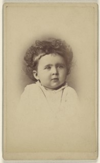 little girl with curly hair, printed in vignette-style; J. Charles Rasmussen, American, active Davenport, Iowa and Rock Island