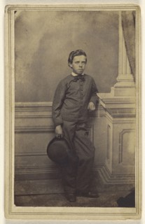 well-dressed young boy standing, holding a derby; S.B. Howard, American, active Pottsville and Reading, Pennsylvania 1860s