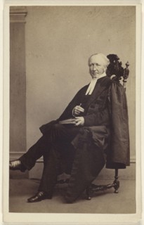 elderly man seated with a book in his lap, finger holding its place; Thomas Rodger, Scottish, 1832 - 1883, 1864 - 1865; Albumen