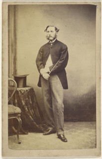 Man holding a cane under his arm; American; 1864 - 1865; Albumen silver print