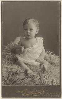 baby seated on a lamb-skin rug; Atelier Rembrandt, French, active Strasbourg, France 1880s - 1910s, 1880 - 1890; Platinum print