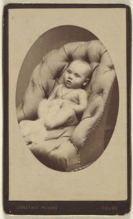 baby seated in a leather arm chair; Constant Peigne, French, 1834 - 1916, about 1870; Albumen silver print