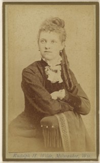 woman seated with arms crossed on chair arm; Rudolph H. Wilde, American, active Milwaukee, Wisconsin 1860s, 1865 - 1875