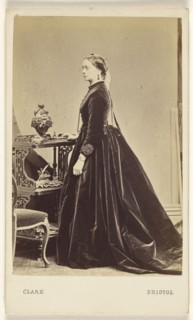 woman wearing a long dress, in profile, standing; William Clark, British, active 1860s, 1865 - 1875; Albumen silver print
