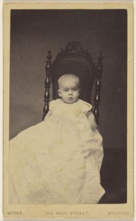 baby wearing a long gown, seated in a high backed chair; W.M. Wires, American, active Milford, Connecticut 1870s - 1910s, 1865