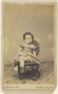 little girl seated in a small chair; Johnston Brothers R.G. & ? Johnston; 1870-1880; Albumen silver print