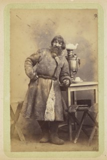 Man in coat leaning on table; William Carrick, Scottish, 1827 - 1878, Russia; about 1860 - 1870; Albumen silver print