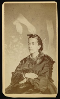 woman seated with arms of a  spirit  over her head; William H. Mumler, American, 1832 - 1884, Boston, Massachusetts, United