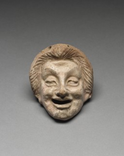 Young Man; Tarentum, Taras, South Italy; 300 - 200 B.C; Terracotta with white slip and polychromy, brownish red, pink