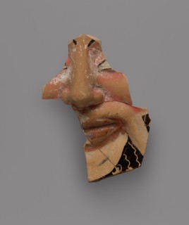 Fragment of a Black-Glaze Kantharos with Mask of Dionysos, part of