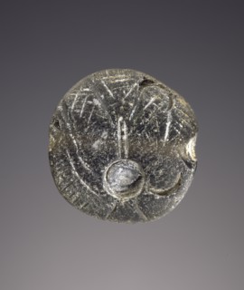 Lentoid engraved seal; Crete, Greece; Obsidian; 0.5 × 1.7 × 1.6 cm, 3,16 × 11,16 × 5,8 in