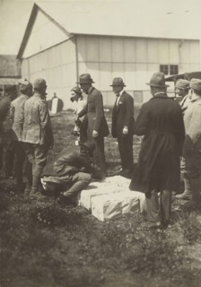 Men standing around white boxes on the ground; Fédèle Azari, Italian, 1895 - 1930, Italy; 1914 - 1929; Gelatin silver print
