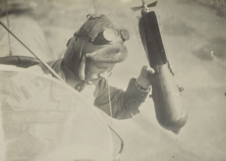 Man in airplane dropping a bomb; Fédèle Azari, Italian, 1895 - 1930, Italy; 1914 - 1918; Gelatin silver print; 11.3 x 16 cm