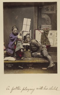 A father playing with his child; Shinichi Suzuki, Japanese, 1835 - 1919, Japan; about 1873 - 1883; Hand-colored Albumen silver