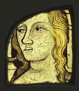 Female Head; English?; England, ?, about 1420 - 1430; Colorless glass, vitreous paint, and silver stain; 15.4 x 11.9 x 1 cm