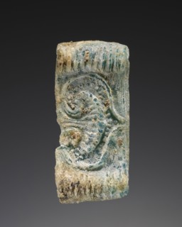 Cast pendant bead; Greece; about 14th century B.C; Glass; 2.9 × 1.3 × 0.5 cm, 1 1,8 × 1,2 × 3,16 in