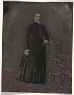 Portrait of standing woman; United States; 1860s - 1880s; Hand-colored tintype; Sheet: 21.2 x 16.3 cm, 8 3,8 x 6 7,16 in