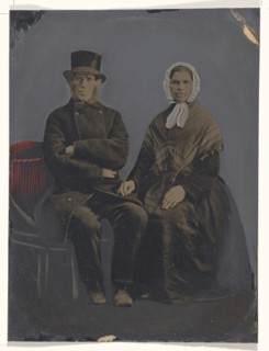 Portrait of seated couple; United States; 1860s - 1880s; Hand-colored tintype; Sheet: 19.9 x 15 cm, 7 13,16 x 5 7,8 in