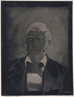 Portrait of man with large bow tie; United States; 1860s - 1880s; Hand-colored tintype; Sheet: 21.9 x 16.6 cm, 8 5,8 x 6 9,16 in