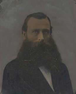 Portrait of man with large beard; United States; 1860s - 1880s; Hand-colored tintype; Sheet: 25 x 19.8 cm, 9 13,16 x 7 13,16 in