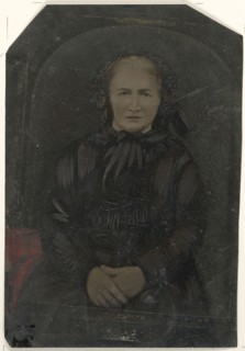 Portrait of woman in black bonnet; United States; 1860s - 1880s; Hand-colored tintype; Sheet: 25.5 x 17.2 cm, 10 1,16 x 6 3,4 in