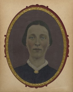 Portrait of woman; United States; 1860s - 1880s; Hand-colored tintype; Sheet: 21 x 16.1 cm, 8 1,4 x 6 5,16 in