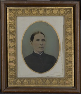 Portrait of woman; United States; 1860s - 1880s; Hand-colored tintype; 20.2 × 14.7 cm, 7 15,16 × 5 13,16 in