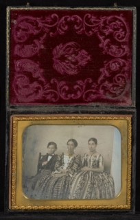 Horizontal Portrait of Two Seated Women and a Boy; Mexico; about 1850s; Hand-colored Daguerreotype