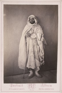 Algerian man with staff, Cities and sites cabinet card collection, Veuve Plasse et Oberty, Albumen, after 1867, Portrait Album