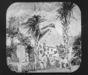 Alice Le Plongeon and a Yucatecan family in front of a thatched house, Augustus and Alice Dixon Le Plongeon papers, 1763-1937