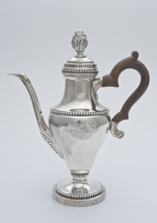 Silver jug with wooden handle with reversed pear-shaped body, with family crest, long narrow decorated spout and bud