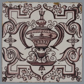 Tile, purple on white, vase with round floral ornaments, framed by régence decoration, wall tile tile sculpture ceramics pottery