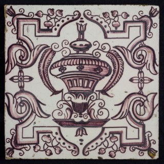 Tile, purple on white, vase with round floral ornaments, framed by régence decoration, wall tile tile sculpture ceramic