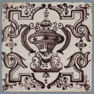 Tile, purple on white, vase with round floral ornaments, framed by régence decoration, wall tile tile sculpture ceramic