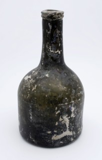 Cylindrical (wine) bottle, clock model, bottle holder soil found glass, free blown and molded in mold blown glass application