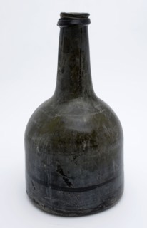 Cylindrical (wine) bottle, clock model, bottle holder bottomfound glass, free blown and molded in mold blown glass application