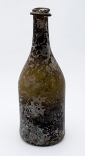 Cylindrical bottle, bottle holder soil found glass, hand-blown glass application Cylindrical bottle in clear light green glass