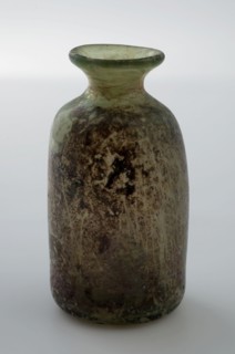 Small cylindrical bottle with funnel-shaped neck and round shoulder, medicine bottle bottle holder soil find glass, free blown