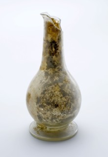 Small bulbous bottle or vial, (medicine?) Bottle holder bottomfound glass, free blown and shaped Small bulbous (pour?) Bottle