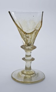 Fragment of foot, trunk and part of calyx of chalice, wine glass drinking glass drinking utensils tableware holder soil find