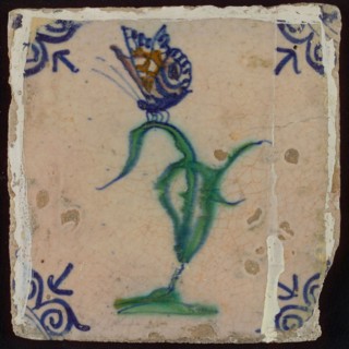 Tile, flower on ground with butterfly in orange, purple, green and blue on white, corner pattern ox head, wall tile