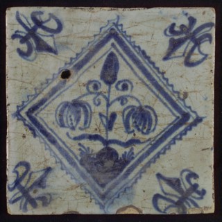 Tile, double flower on spot in blue on white, inside serrated square, corner pattern french lily, wall tile tile sculpture