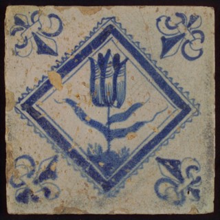 Tile, tulip on ground in blue on white, inside serrated square, corner pattern french lily, wall tile tile sculpture ceramic