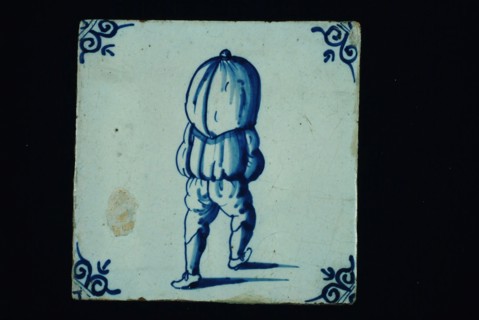 Profession tile, blue with sack carrier seen on the back, corner motif ox's head, wall tile tile sculpture ceramic earthenware