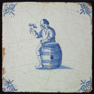 Occupation tile, blue with cooper, with raised hammer, corner motif oxen head, wall tile tile sculpture ceramic earthenware
