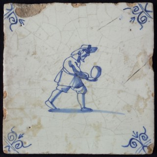 Occupation tile, blue with man who is bolting, corner motif ox's head, wall tile tile sculpture ceramic earthenware glaze, baked