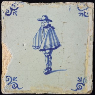 Figure tile, blue with man with wide cape, patrician, corner motif ox's head, wall tile tile sculpture ceramic earthenware glaze