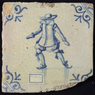 Figure tile, blue with skating man, nobleman, nicely dressed with big hat, corner pattern ox-head, wall tile tile footage earth